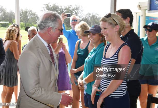 Prince Charles, Prince of Wales greets tourists before a roundtable meeting, discussing coral resilience on Lady Elliot Island on April 6, 2018 in...