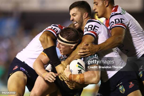 Paul Gallen of the Sharks is tackled by Roosters defence during the round five NRL match between the Cronulla Sharks and the Sydney Roosters at...