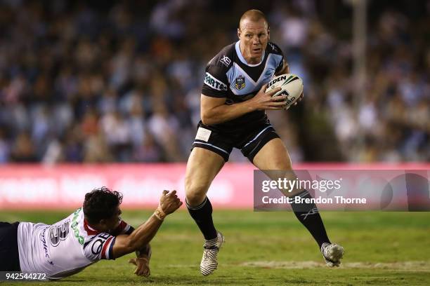 Luke Lewis of the Sharks runs the ball during the round five NRL match between the Cronulla Sharks and the Sydney Roosters at Southern Cross Group...