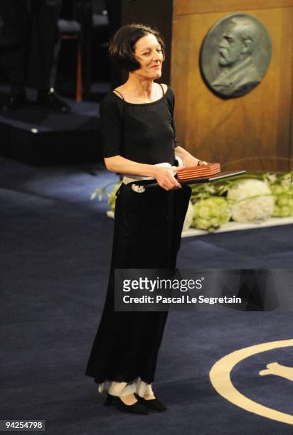 Herta Muller of Germany receives the Nobel Prize in Literature during the Nobel Foundation Prize Awards Ceremony 2009 at the Concert Hall on December...