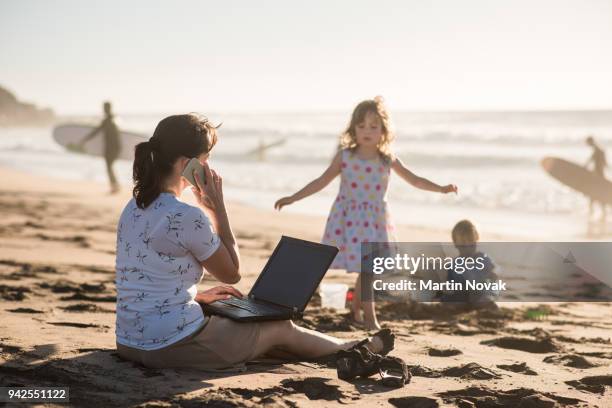 make business from beach - travelgame stock pictures, royalty-free photos & images