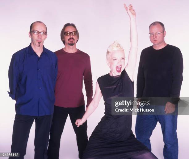 Posed group portrait of Garbage. Left to right are Duke Erikson, Butch Vig, Shirley Manson and Steve Marker in 2002.