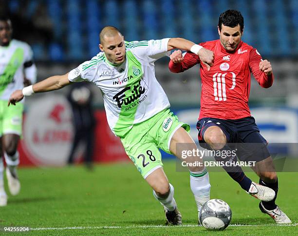 Lille's forward Pierre Alain Frau vies with Saint-Etienne's defender Yohan Belouane during the French L1 football match Lille vs Bordeaux on December...