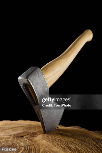 lumberjack axe with wooden handle isolated on black background - hacha pequeña fotografías e imágenes de stock