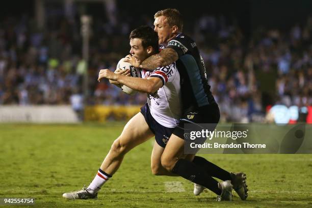 Luke Keary of the Roosters is tackled by Trent Hodkinson of the Sharks during the round five NRL match between the Cronulla Sharks and the Sydney...