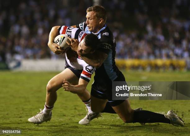 Luke Keary of the Roosters is tackled by Trent Hodkinson of the Sharks during the round five NRL match between the Cronulla Sharks and the Sydney...