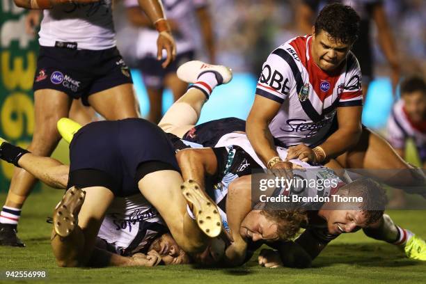 Matthew Moylan of the Sharks is tackled by Roosters defence during the round five NRL match between the Cronulla Sharks and the Sydney Roosters at...