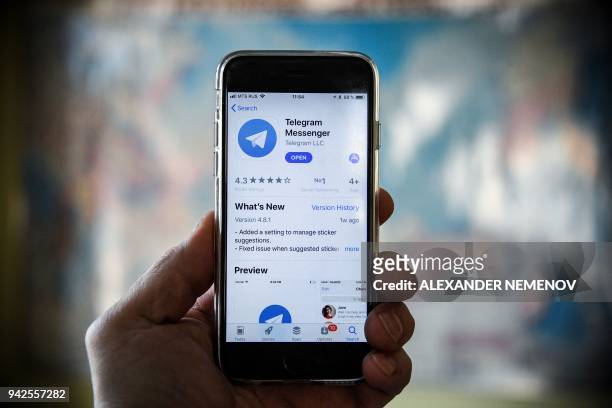 This illustration picture taken on April 6, 2018 in Moscow shows the Telegram messenger application displayed on the screen of a smartphone. Russia's...