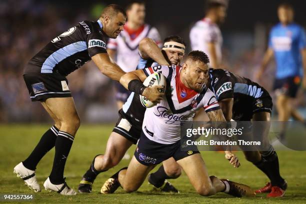 Jared Waerea-Hargreaves of the Roosters is tackled by the Sharks defence during the round five NRL match between the Cronulla Sharks and the Sydney...