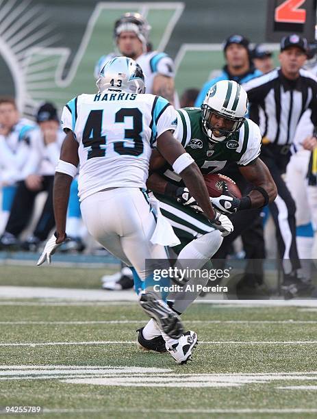 Wide Receiver Braylon Edwards of the New York Jets has a long gain against the Carolina Panthers at Giants Stadium on November 29, 2009 in East...