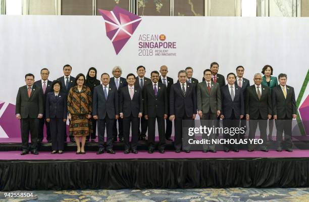 Asian Foreign ministers and central bank governors pose for a group photograph at the ASEAN Finance Ministers' and Central Bank Governors' meeting in...