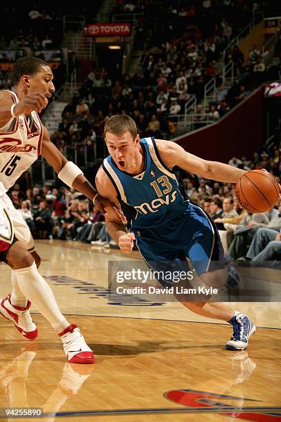 Matt Carroll of the Dallas Mavericks drives to the basket past Jamario Moon of the Cleveland Cavaliers during the game on November 28, 2009 at...