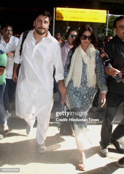 Bollywood actor Sonali Bendre and her husband Goldie Behl arrive at Mumbai airport after been acquitted in the Blackbuck poaching case, on April 5,...