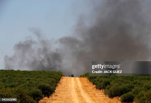 Picture taken on April 6 near the southern Israeli kibbutz of Nahal Oz shows tire burning smokes during a protest at the border with the Gaza strip....