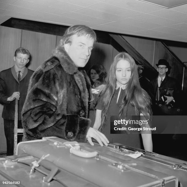 Italian film director Franco Zeffirelli with English-Argentine actress Olivia Hussey at Heathrow Airport, London, UK, 20th March 1968.