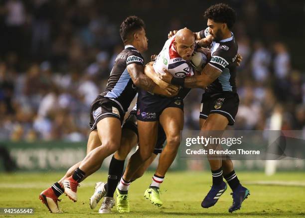 Blake Ferguson of the Roosters is tackled by the Sharks defence during the round five NRL match between the Cronulla Sharks and the Sydney Roosters...