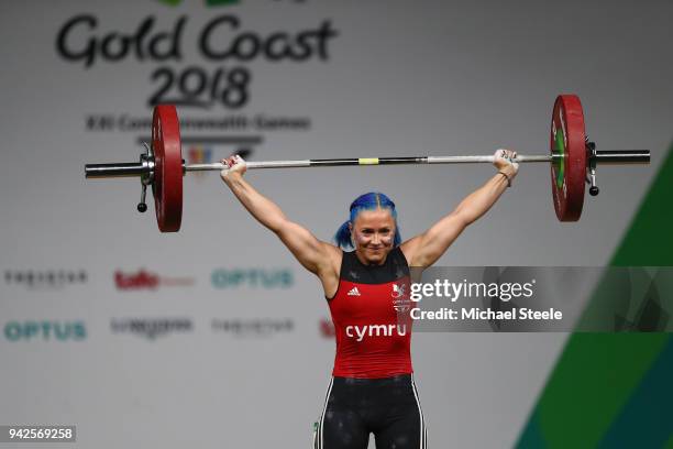 Christie Williams of Wales makes a successful lift in the snatch discipline during the Women's Weightlifting 58kg on day two of the Gold Coast 2018...