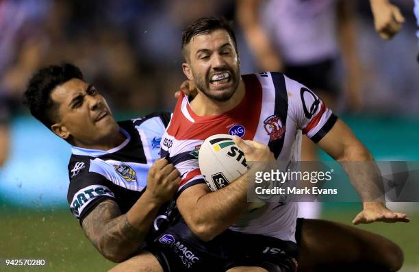 James Tedesco of the Roosters is tacked by Sosaia Feki of the Sharks during the round five NRL match between the Cronulla Sharks and the Sydney...