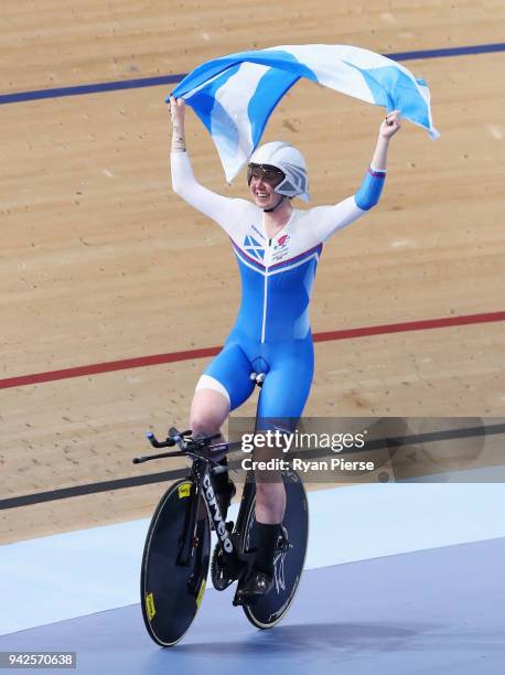 Katie Archibald of Scotland celebrates winning gold in the Women's 3000m Individual Pursuit Gold Final during the Cycling on day two of the Gold...