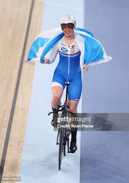 Katie Archibald of Scotland celebrates winning gold in the Women's 3000m Individual Pursuit Gold Final during the Cycling on day two of the Gold...