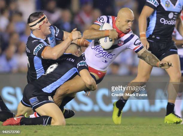 Blake Ferguson of the Roosters is tackled by Paul Gallen of the Sharks during the round five NRL match between the Cronulla Sharks and the Sydney...