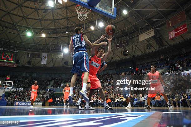 Luksa Andric, #12 of Cibona competes with Fran Vazquez, #17 of Regal FC during the Euroleague Basketball Regular Season 2009-2010 Game Day 7 between...