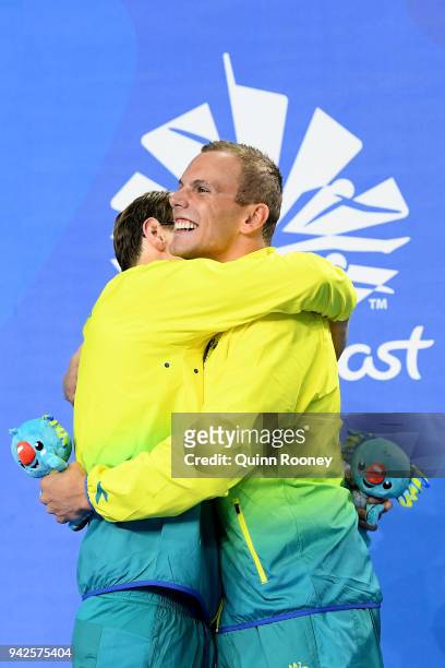 Silver medalist Mack Horton of Australia and gold medalist Kyle Chalmers of Australia embrace during the medal ceremony for the Men's 200m Freestyle...