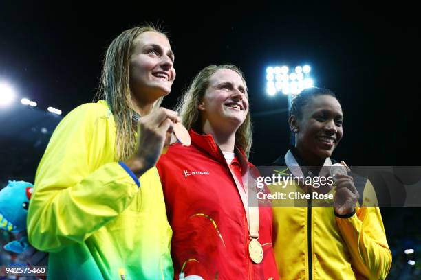 Silver medalist Alia Atkinson of Jamaica, gold medalist Sarah Vasey of England and bronze medalist Leiston Pickett of Australia pose during the medal...