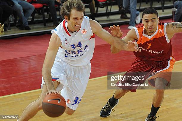 Zoran Planinic, #34 of CSKA Moscow drives past Ibrahim Jaaber, #7 of Lottomatica Roma during the Euroleague Basketball Regular Season 2009-2010 Game...