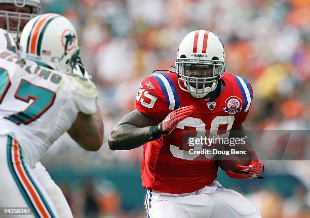 Running back Laurence Maroney of the New England Patriots looks for room to run while taking on the Miami Dolphins at Land Shark Stadium on December...