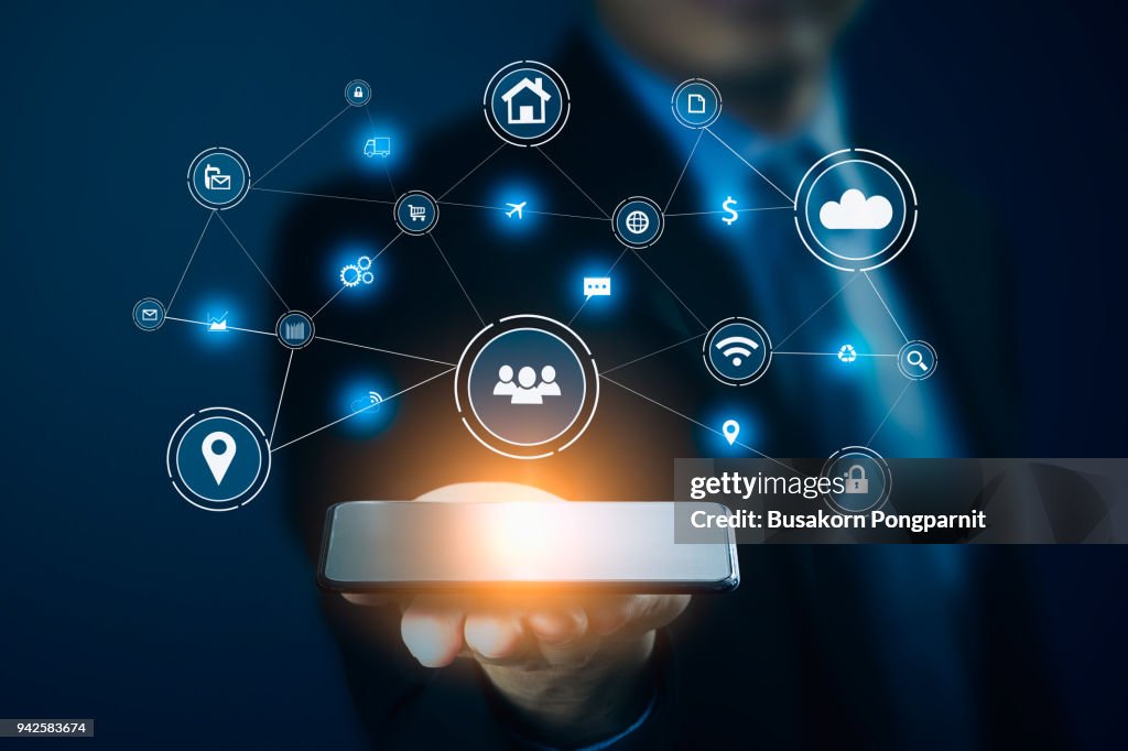 Businessman hand holding smart phone.Virtual digital technology concept,Social media