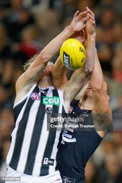 Jaidyn Stephenson of the Magpies and Liam Jones of the Blues compete during the round three AFL match between the Carlton Blues and the Collingwood...