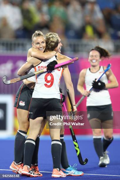 Susannah Townsend of England is congratulated on her goal during their Womens Hockey match between England and Wales on day two of the Gold Coast...