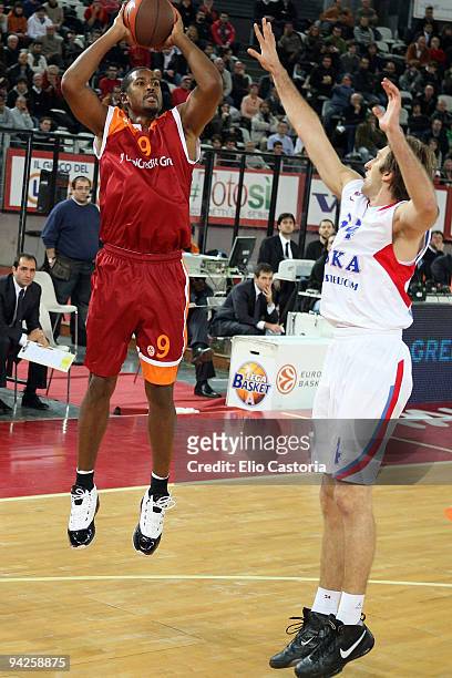 Andre Hutson, #9 of Lottomatica Roma shoots over Zoran Planinic, #34 of CSKA Moscow during the Euroleague Basketball Regular Season 2009-2010 Game...