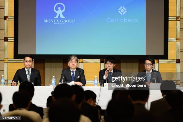 Koichiro Wada, president of Coincheck Inc., second right, speaks as Yusuke Otsuka, chief operating officer of Coincheck Inc., right, Toshihiko...