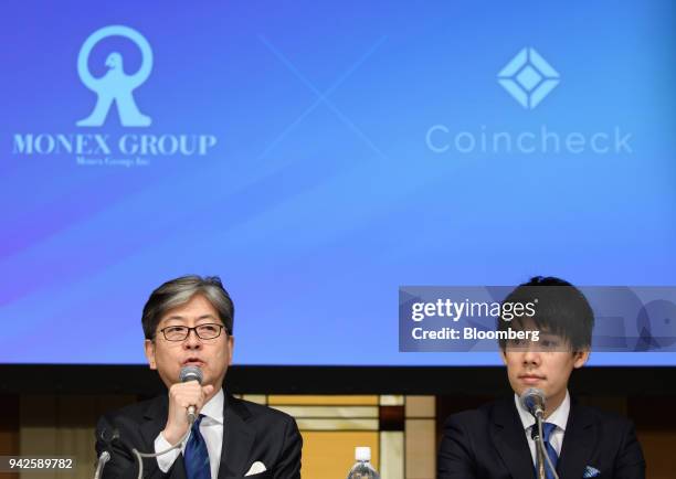 Oki Matsumoto, president and chief executive officer of Monex Group Inc., left, speaks next to Koichiro Wada, president of Coincheck Inc., during a...