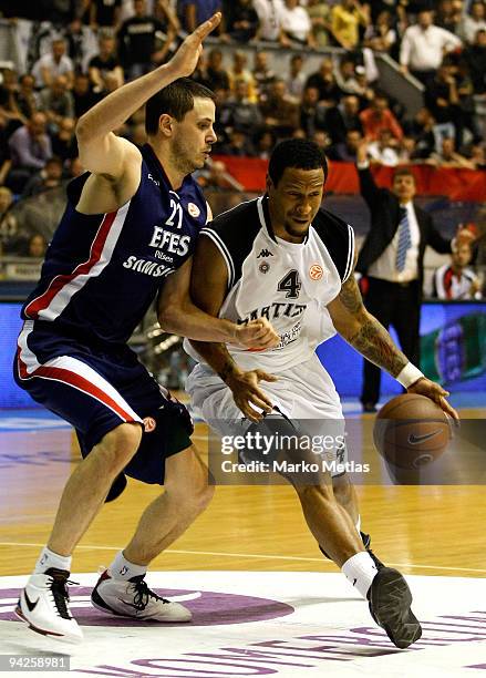 Lawrence Roberts, #4 of Partizan Belgrade competes with Bostjan Nachbar, #21 of Efes Pilsen Istanbul in action during the Euroleague Basketball...