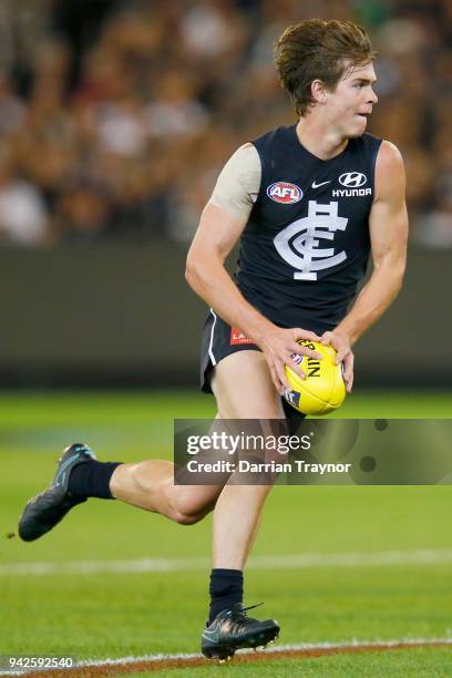 Paddy Dow of the Blues runs with the ball during the round three AFL match between the Carlton Blues and the Collingwood Magpies at Melbourne Cricket...