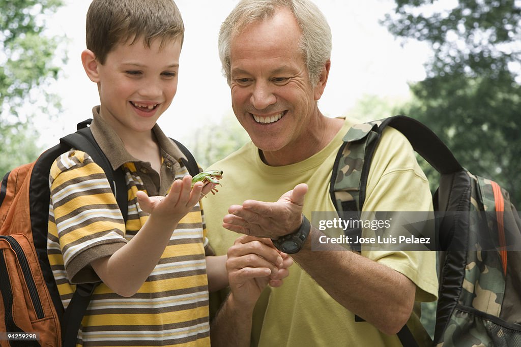 Father and son with lizard