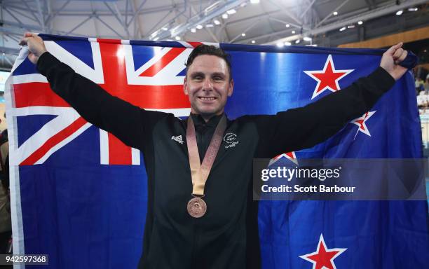 Bronze medalist Edward Dawkins of New Zealand celebrates during the medal ceremony for the Men's Keirin Finals on day two of the Gold Coast 2018...