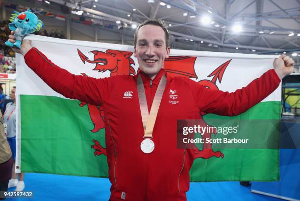 Silver medalist Lewis Oliva of Wales celebrates during the medal ceremony for the Men's Keirin Finals on day two of the Gold Coast 2018 Commonwealth...