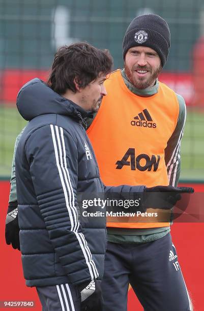 Michael Carrick and Assistant Manager Rui Faria of Manchester United in action during a first team training session at Aon Training Complex on April...