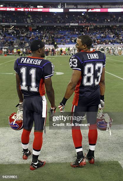 Roscoe Parrish and Lee Evans of the Buffalo Bills share a conversation on the side line during their NFL game against the New York Jets on December...