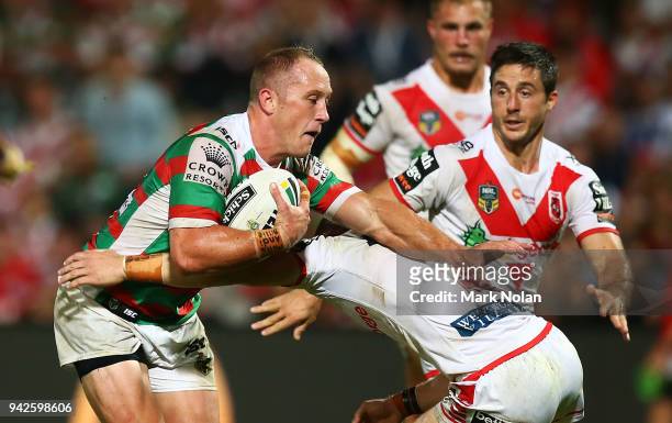 Jason Clark of the Rabbitohs is tackled during the round five NRL match between the St George Illawarra Dragons and the South Sydney Rabbitohs at UOW...