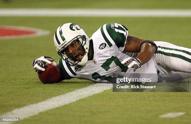 Braylon Edwards of the New York Jets falls with the ball in the end zone for a touchdown during their NFL game against the Buffalo Bills on December...