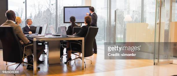 business people having business meeting - formal businesswear stock pictures, royalty-free photos & images