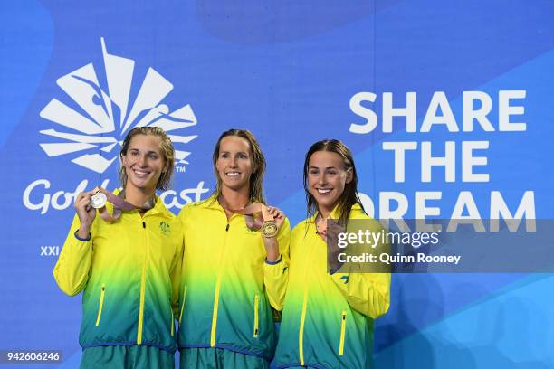Silver medalist Madeline Groves of Australia, gold medalist Emma McKeon of Australia and bronze medalist Brianna Throssell of Australia pose during...