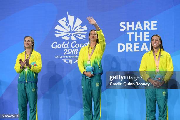 Silver medalist Madeline Groves of Australia, gold medalist Emma McKeon of Australia and bronze medalist Brianna Throssell of Australia pose during...