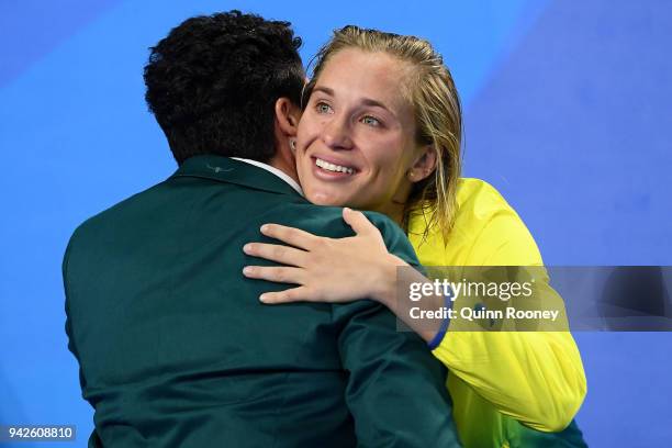Silver medalist Madeline Groves of Australia receives her medal during the medal ceremony for the Women's 100m Butterfly Final on day two of the Gold...