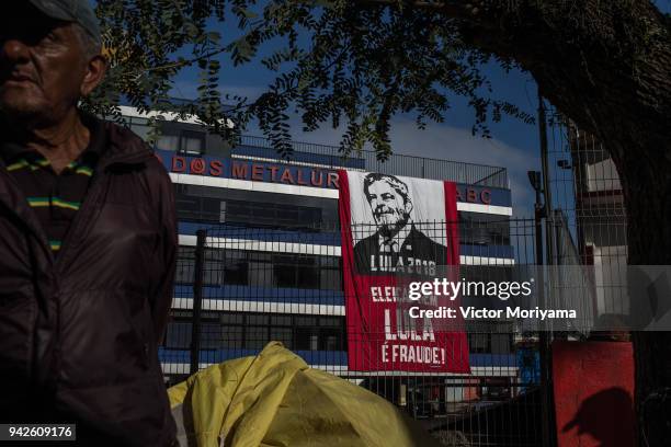 Sign is posted as supporters of former President Luiz Inacio Lula da Silva gather in front of the headquarters of the Metalworkers' Union while...